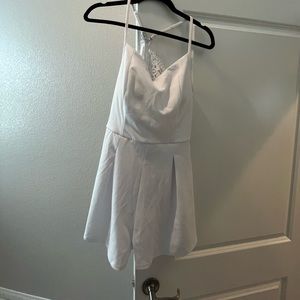 White Francesca’s Romper. NWT size large.